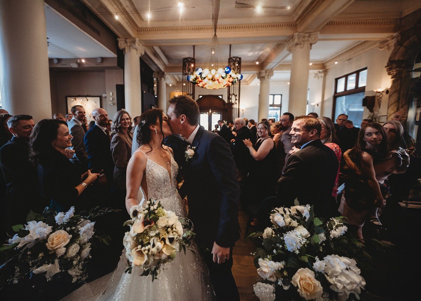 Lindsey and Taylor recessional after their Teatro Calgary wedding ceremony