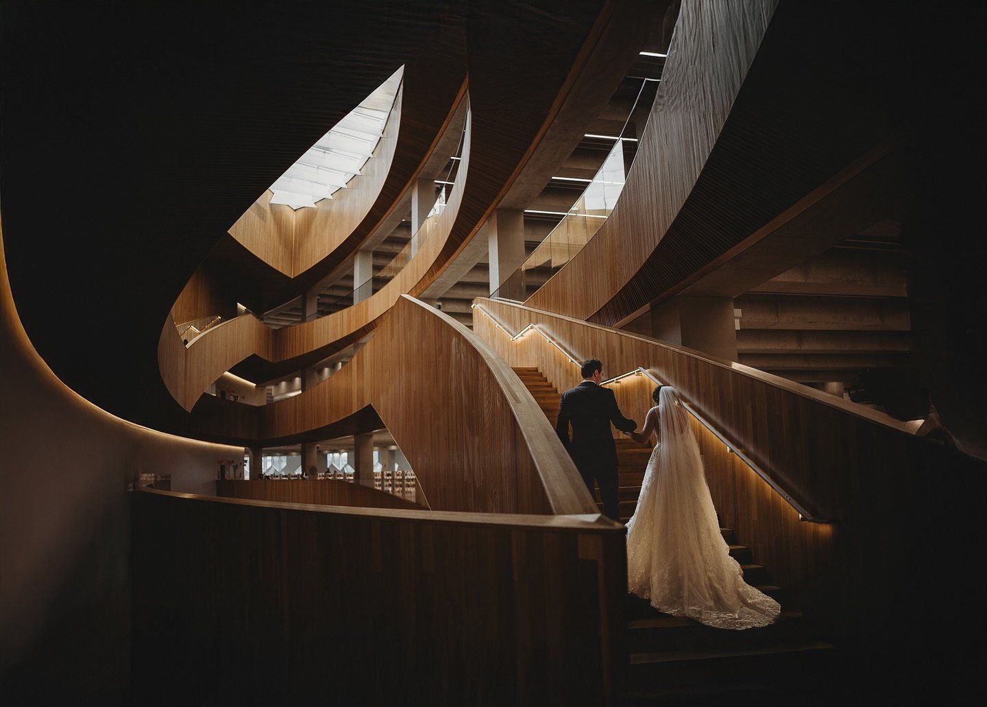 Bride on a spiral staircase in downtown Calgary, Calgary wedding photographer Tkshotz