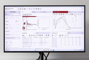 Monitor displaying a data analytics dashboard with charts, graphs, and settings panels in a professional software interface.