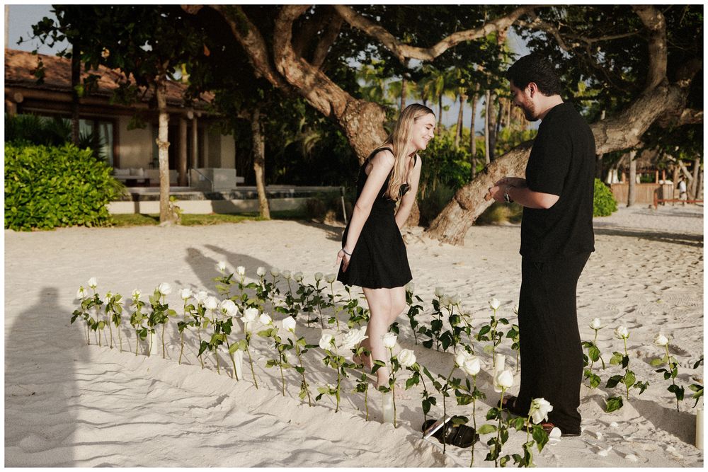 Couple sharing a romantic moment on a tropical beach at The St. Regis Punta Mita during their engagement session.