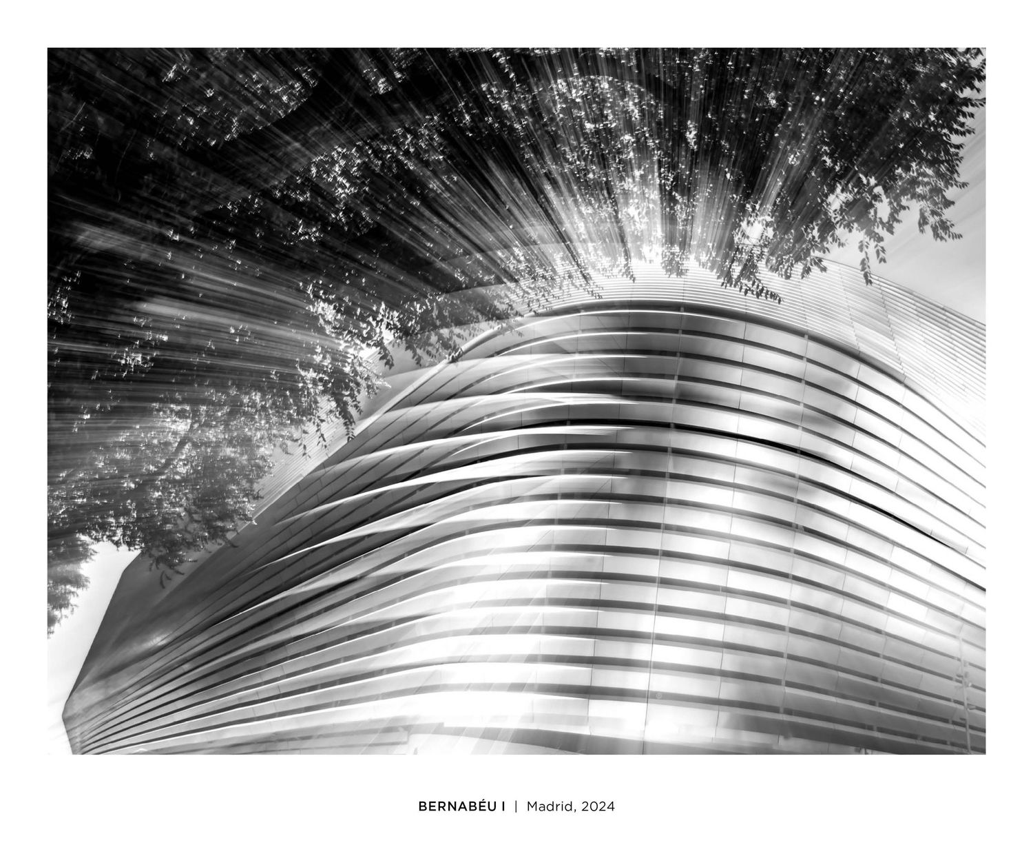 Black and white architectural photo of the Bernabeu stadium exterior in Madrid, 2024.