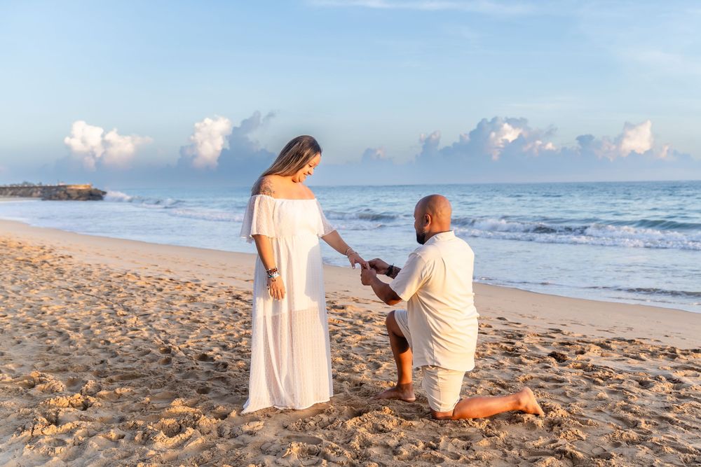 Emotional proposal moment on beach in San Juan Puerto Rico at sunrise.