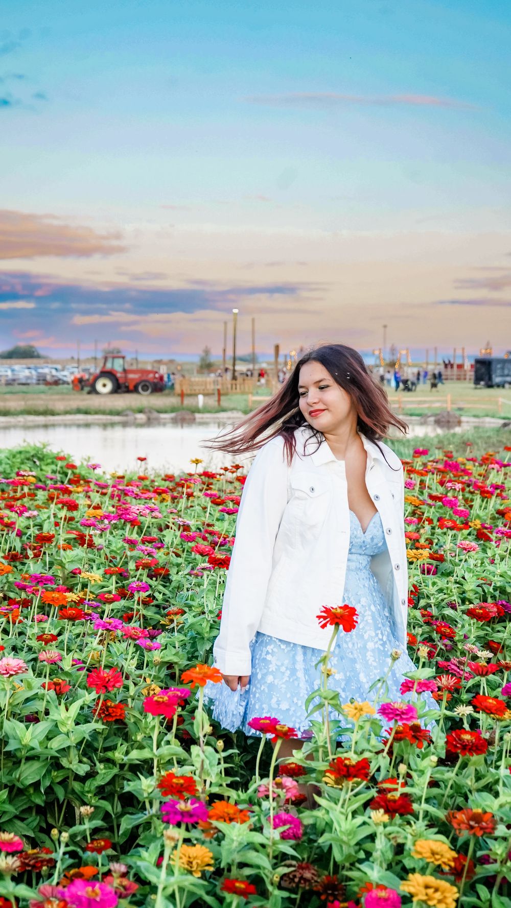 A spring portrait session in a vibrant field of colorful zinnias.