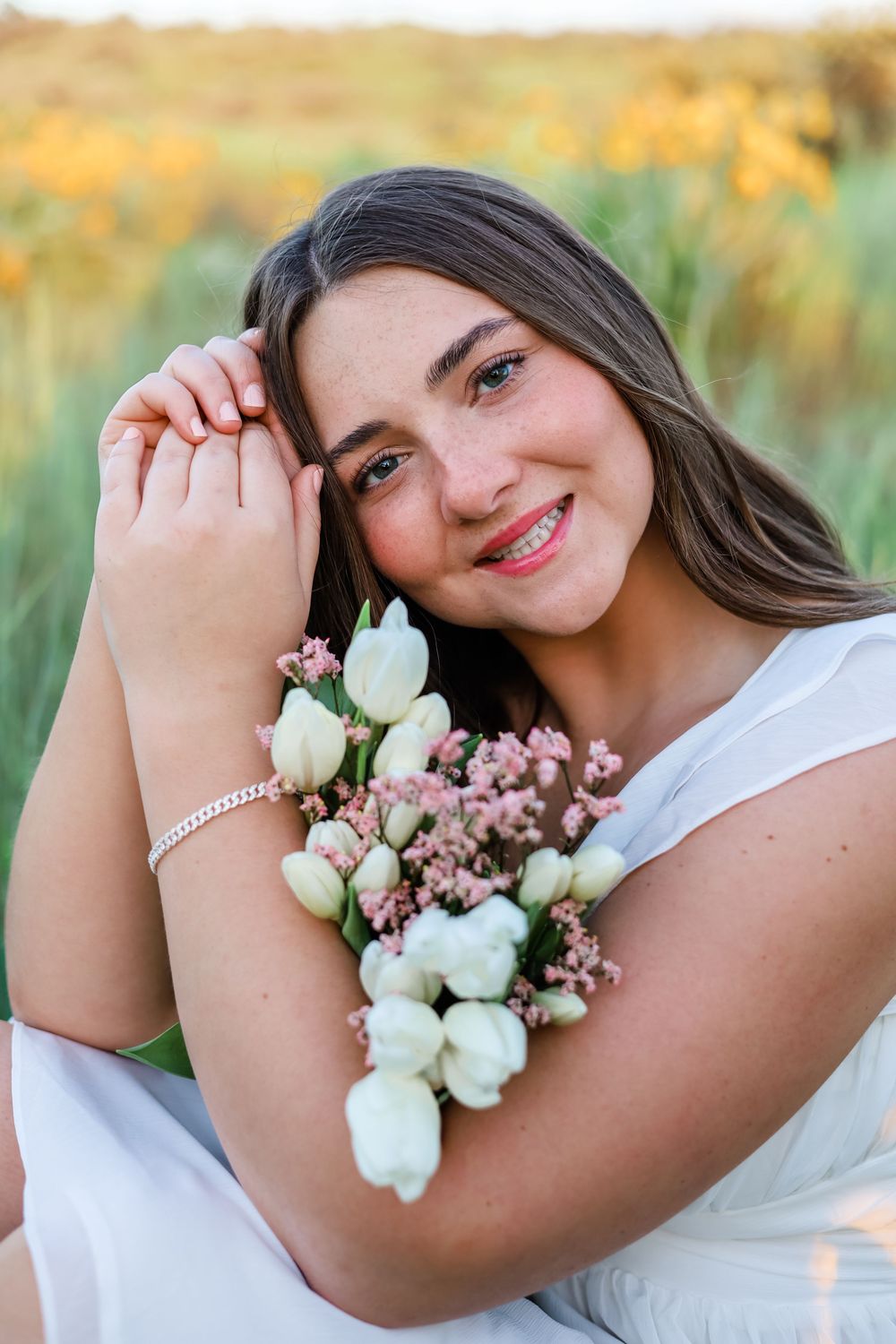 A dreamy portrait session featuring white roses and delicate floral accessories.