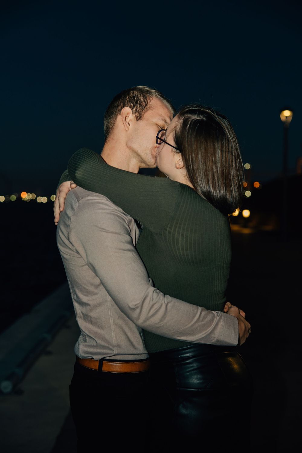 flash photography, couple kissing in the dark