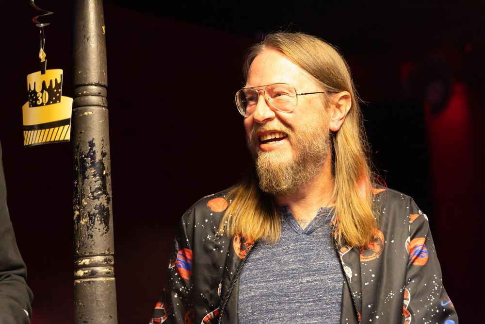 A man laughing.