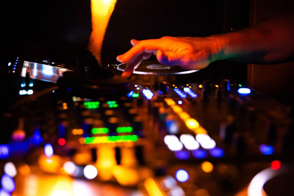 A mans hand in action as a DJ.