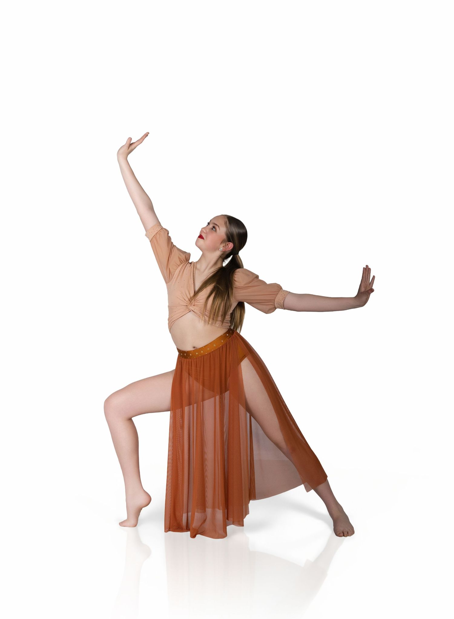 Graceful dancer in a flowing brown dress performs a contemporary dance sequence across four dynamic poses.