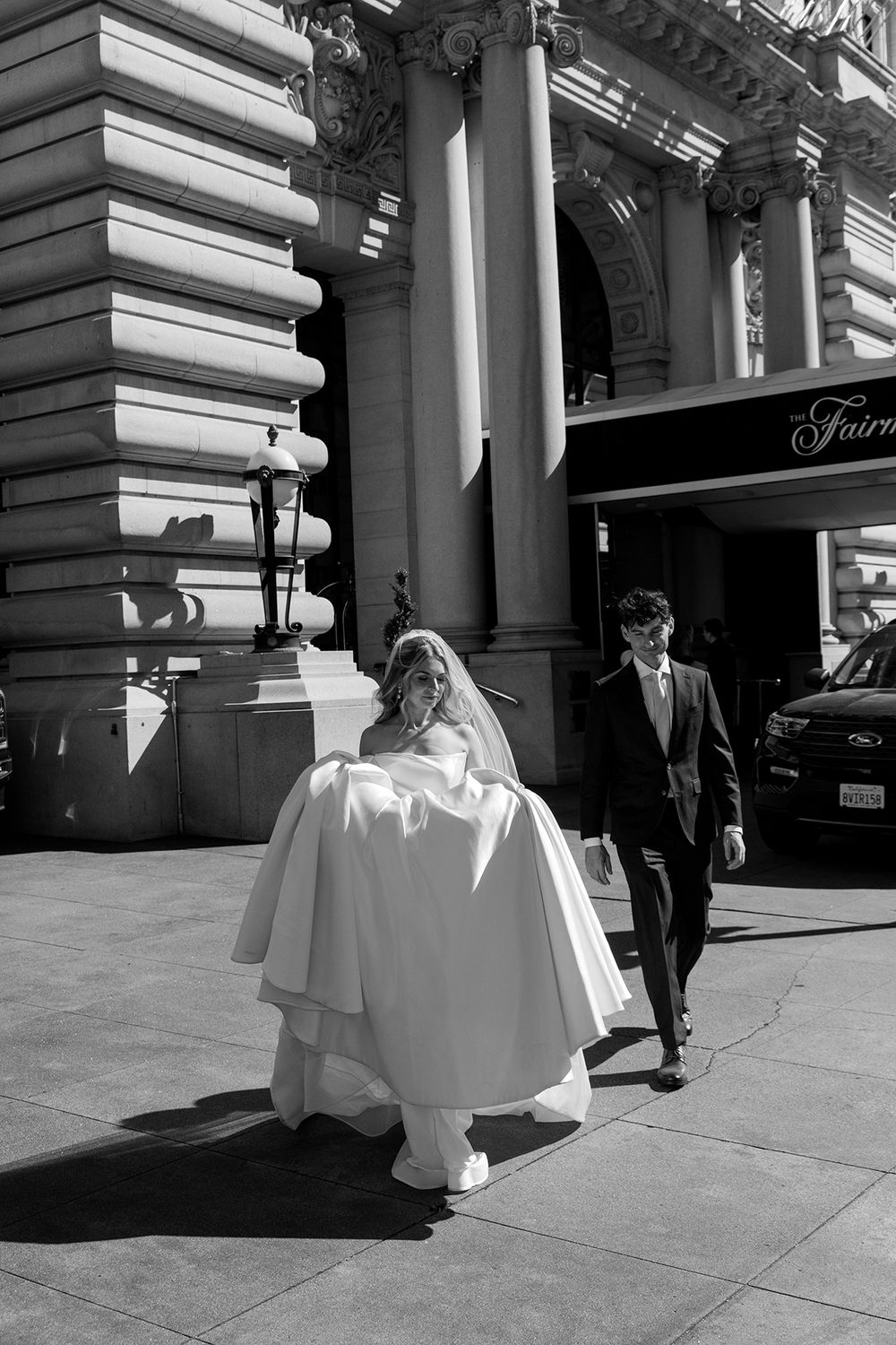 A black and white photo sequence showing people walking past a building entrance with ornate classical columns.