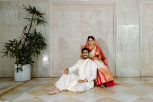 Minimalist indoor portraits against white marble walls with bamboo plant accents.