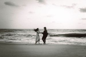 Black and white beach scenes with silhouettes walking along the shoreline.