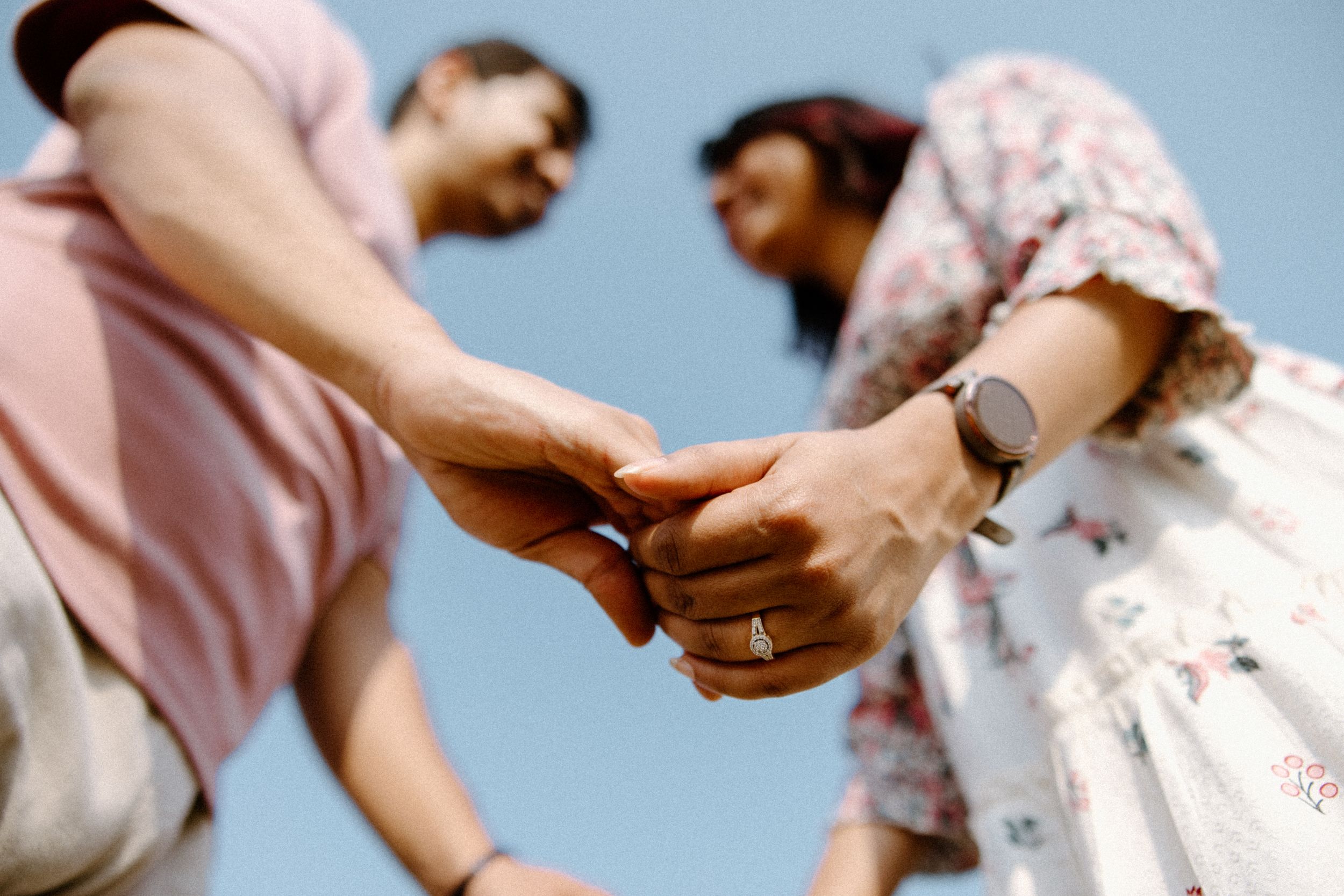 A series of candid moments showing a couple in joyful interaction during a romantic photoshoot.