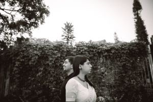 Garden photoshoot sequence showing romantic poses among lush greenery.