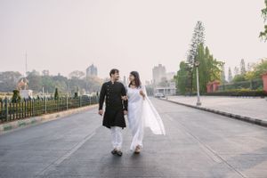 Urban engagement photoshoot sequence on a modern walkway with city views.