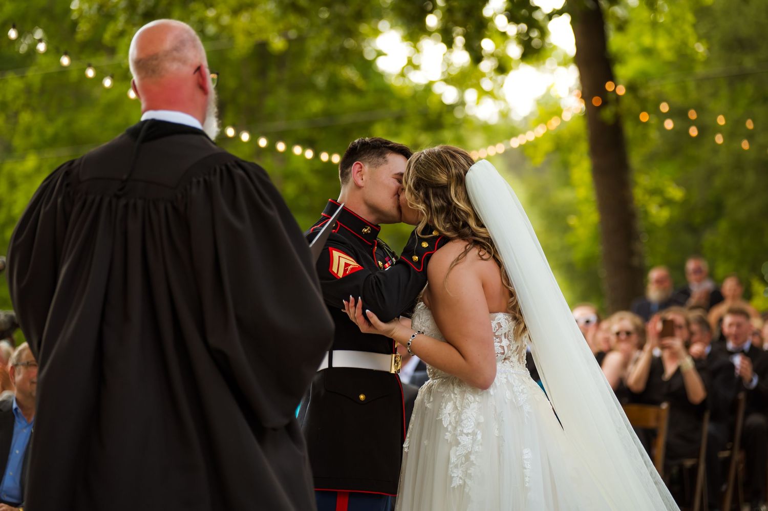 Wedding couple sharing a first kiss after reciting their vows to one another during their ceremony.
South Carolina Wedding Photgrapher