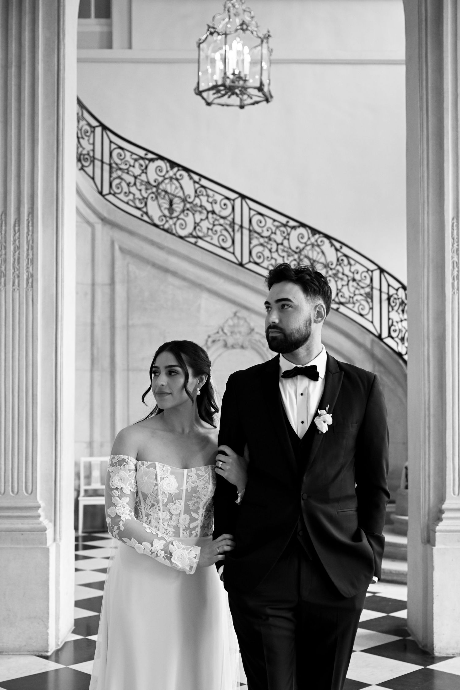 A wedding ceremony takes place on a rooftop in Paris with the Eiffel Tower creating a stunning backdrop.