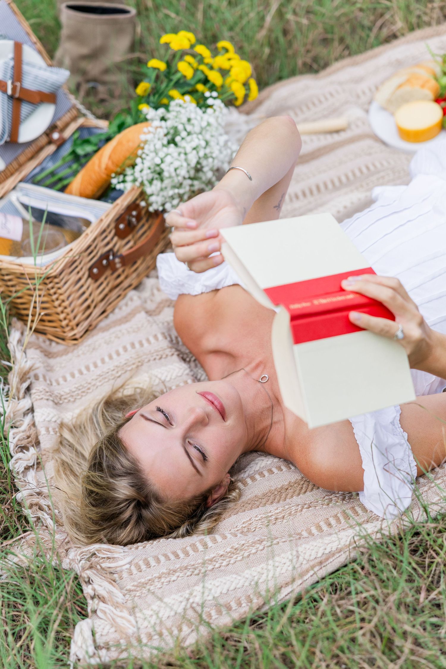 male college graduate sitting on bench