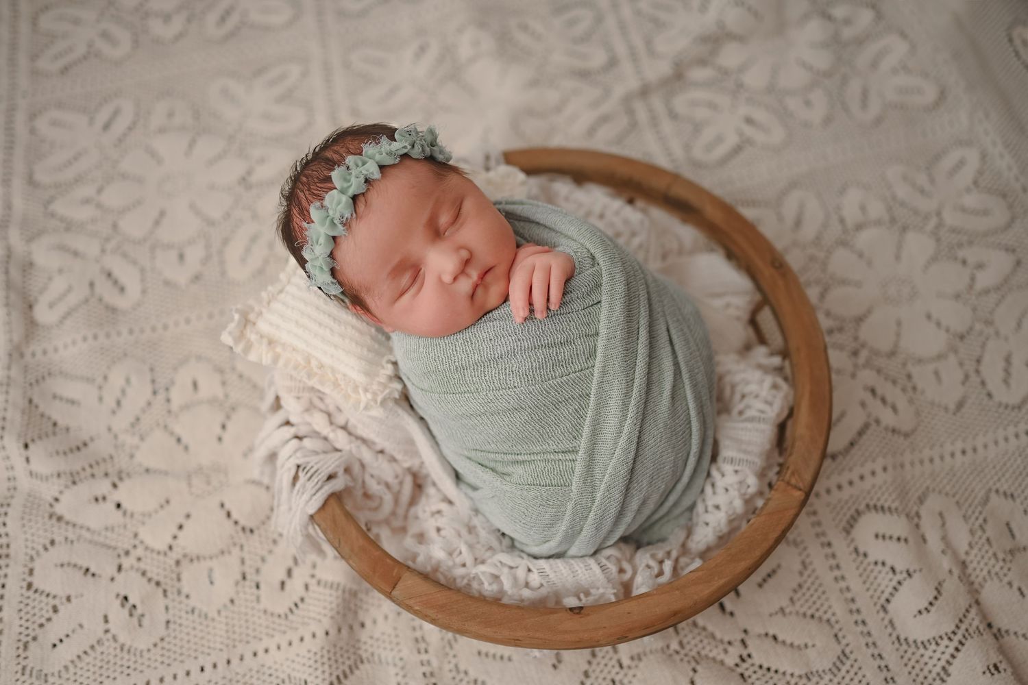 Baby girl in sage wrap and headband. Photo by Disney Magic Photography, Clarksville and Nashville TN newborn photogapher