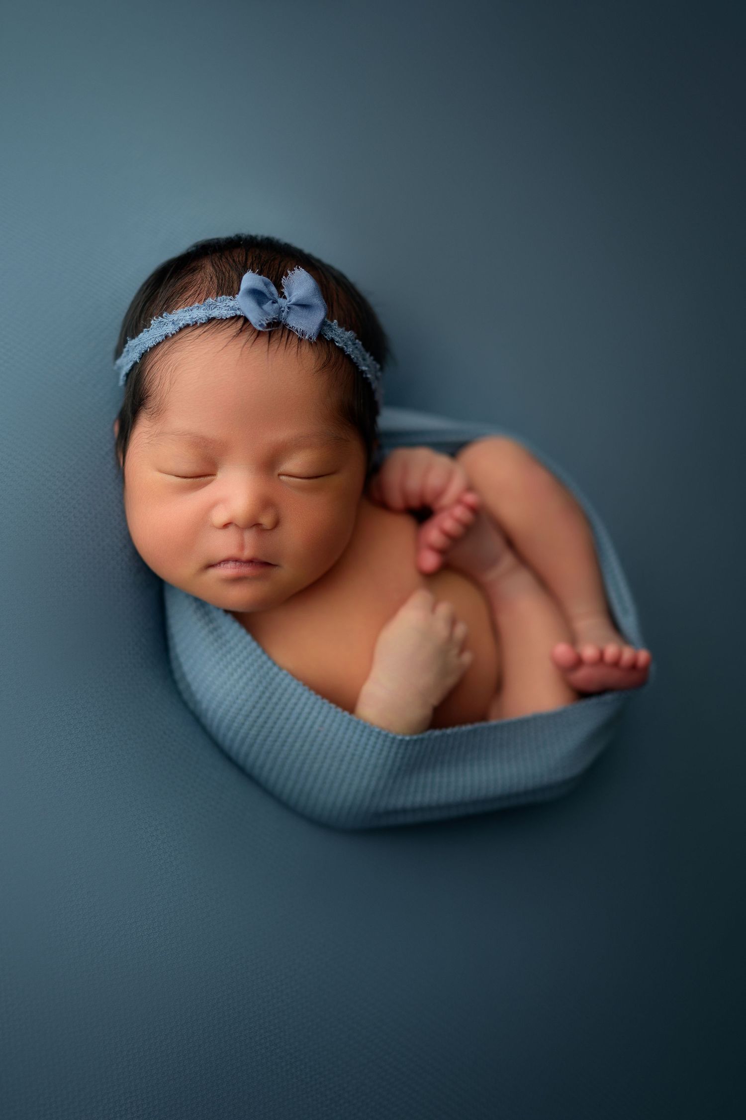 Studio newborn by Dayton, Ohio based newborn photographer Disney Magic Photography, serving Beavercreek, Bellbrook, Kettering and more.
