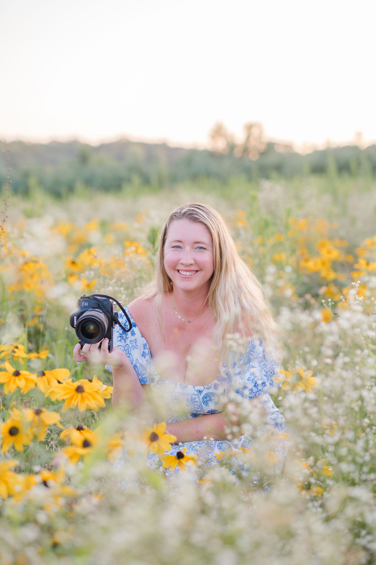photographer in flower field at grace haven farm in Nokesville Virginia