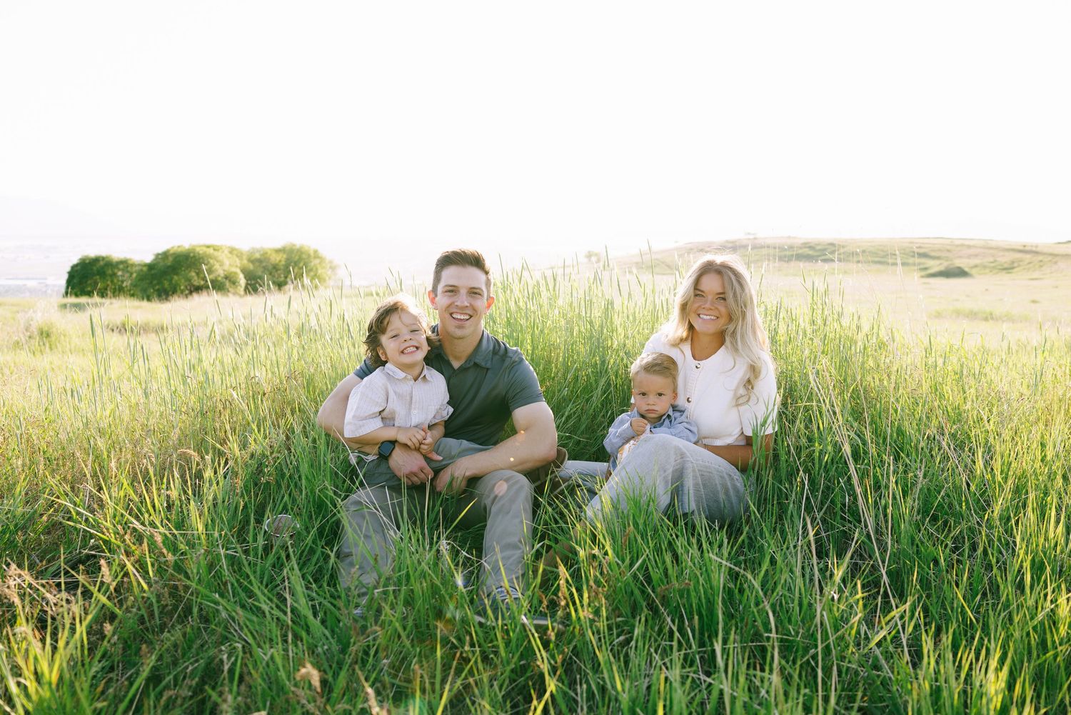 family hugging at utah lake