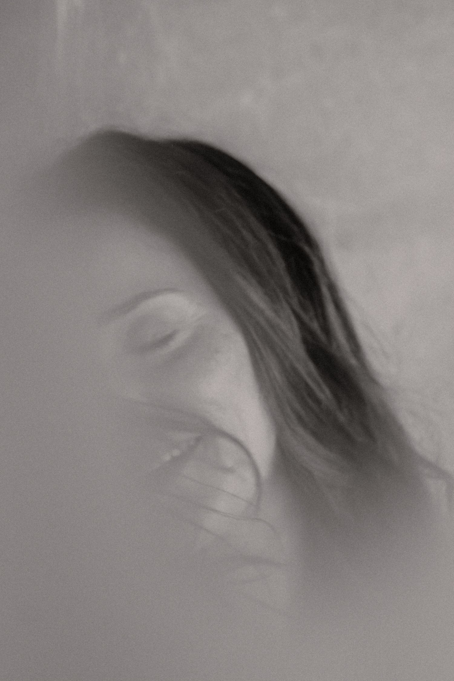 Abstract black and white motion blur sequence creating an ethereal effect.