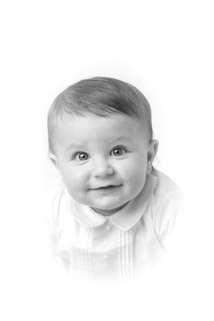 Black and white heirloom portrait photograph of a baby boy in a traditional heirloom outfit.