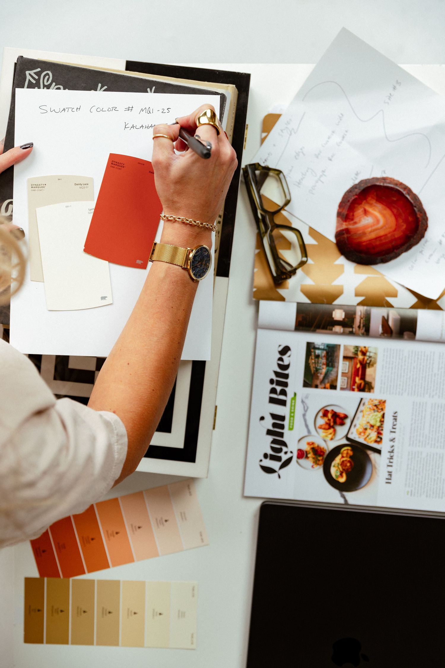 Designer developing a color palette and creative concepts, photographed for authentic brand storytelling and marketing content.