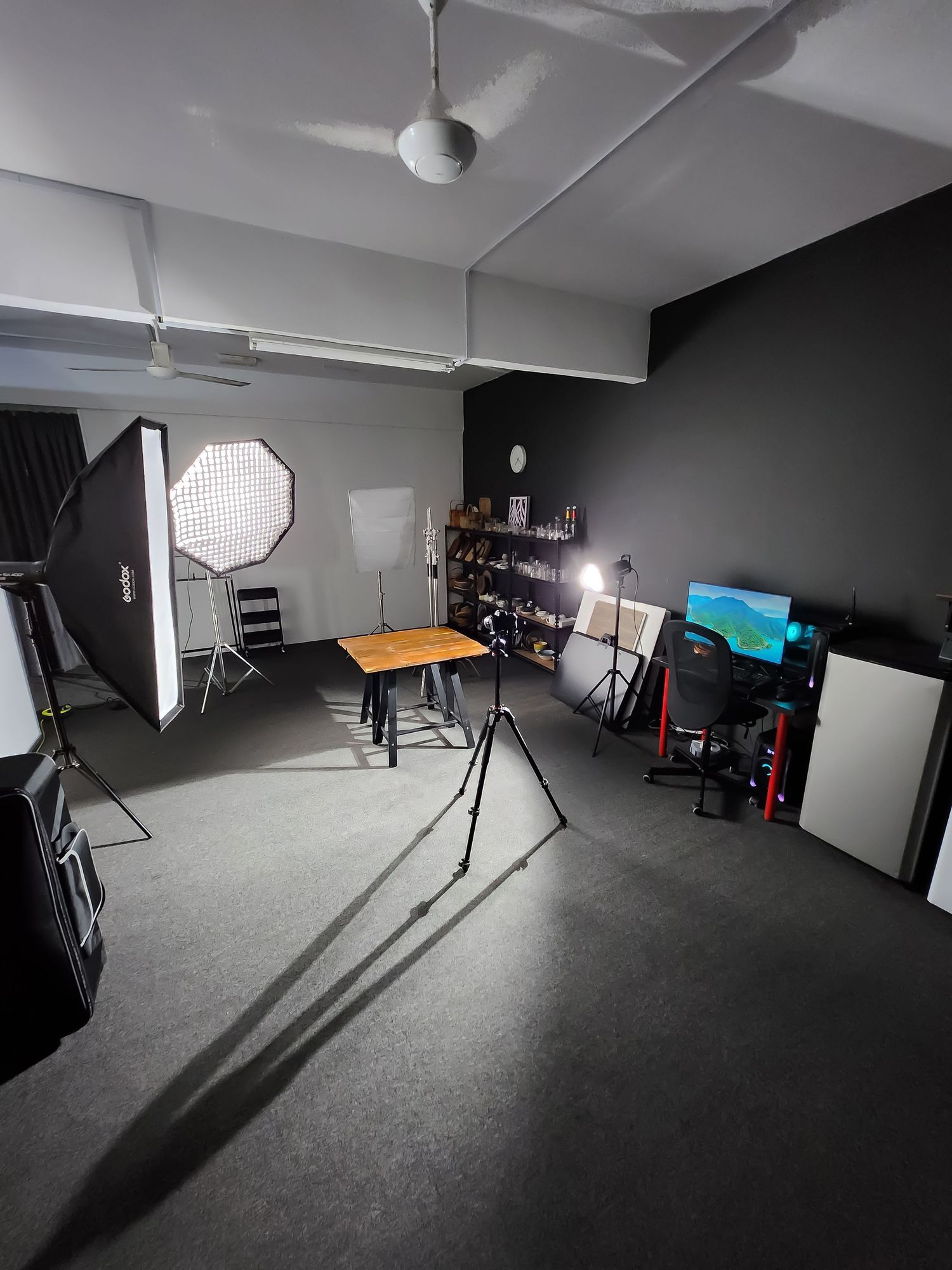 Professional photography studio interior with softboxes and lighting equipment set up.