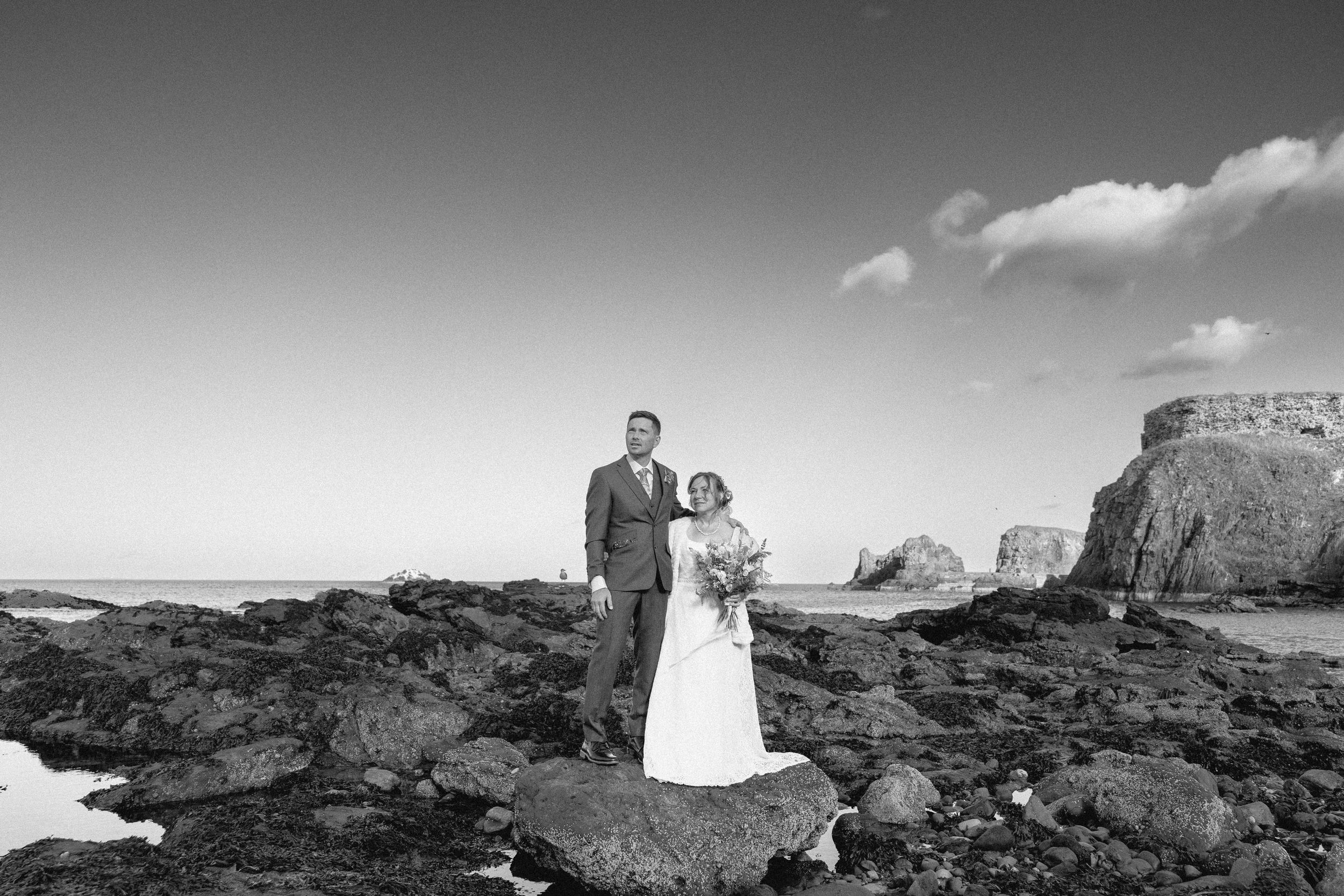 Desert wedding photography with dramatic red rock formations in Monument Valley.