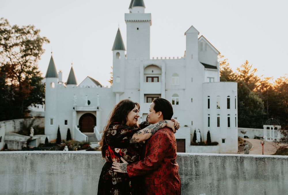 Engaged couple embracing and smiling, capturing a joyful and intimate moment during their engagement photo session