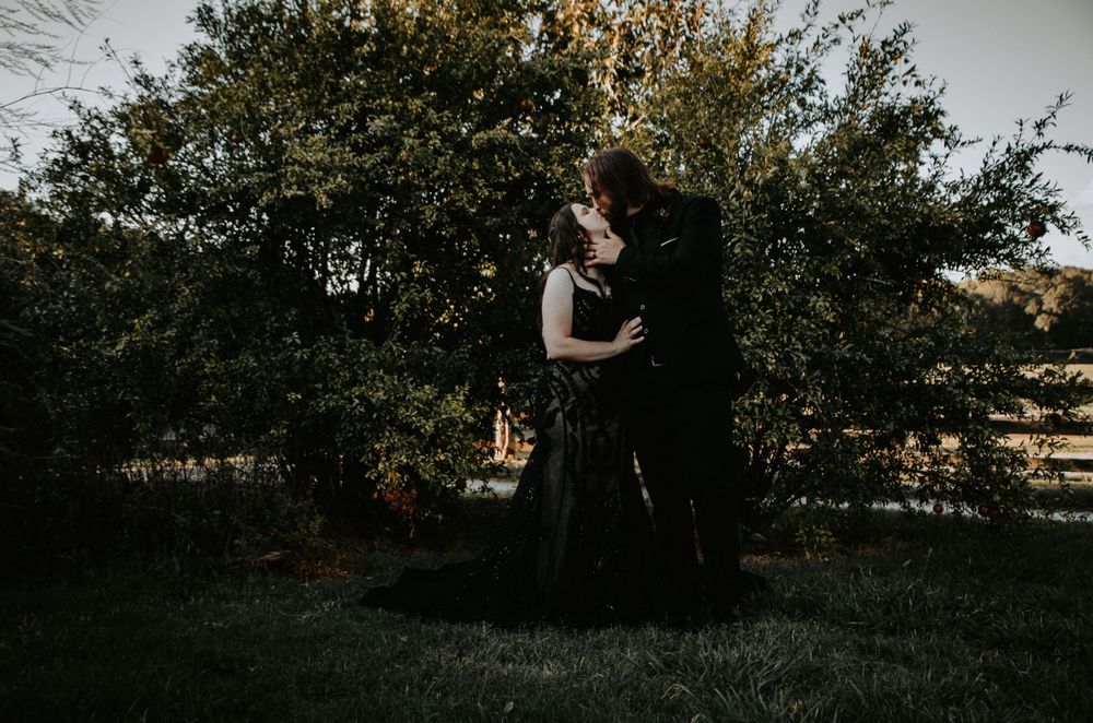Loving couple sharing a tender moment, captured in a natural and romantic setting during a photo session