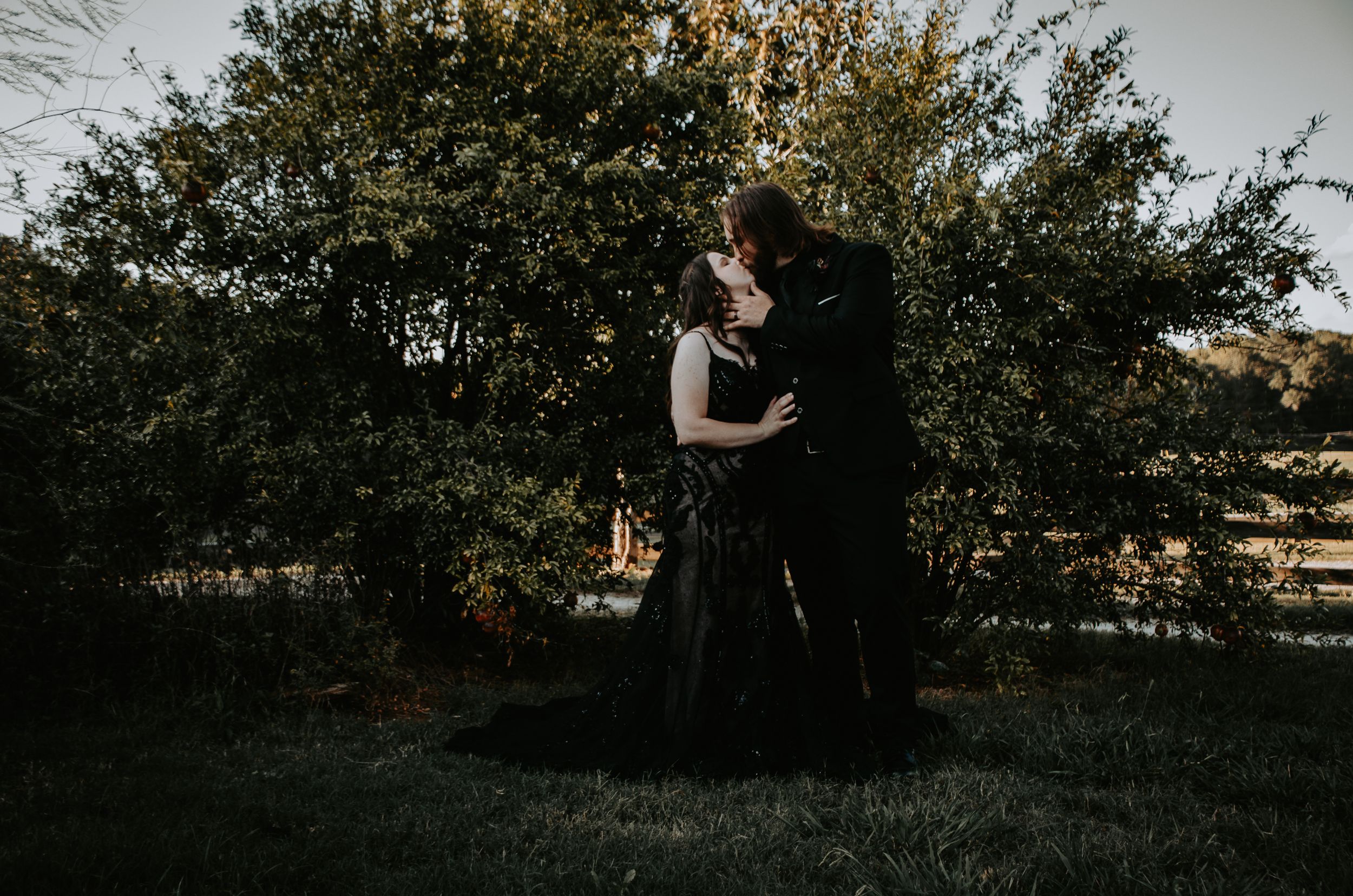 Loving couple sharing a tender moment, captured in a natural and romantic setting during a photo session