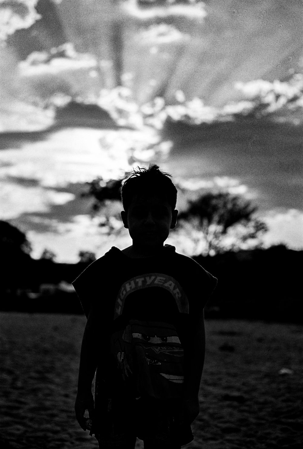 Silhouette portrait of a boy at sunset in Olympiada, Chalkidiki, Greece.