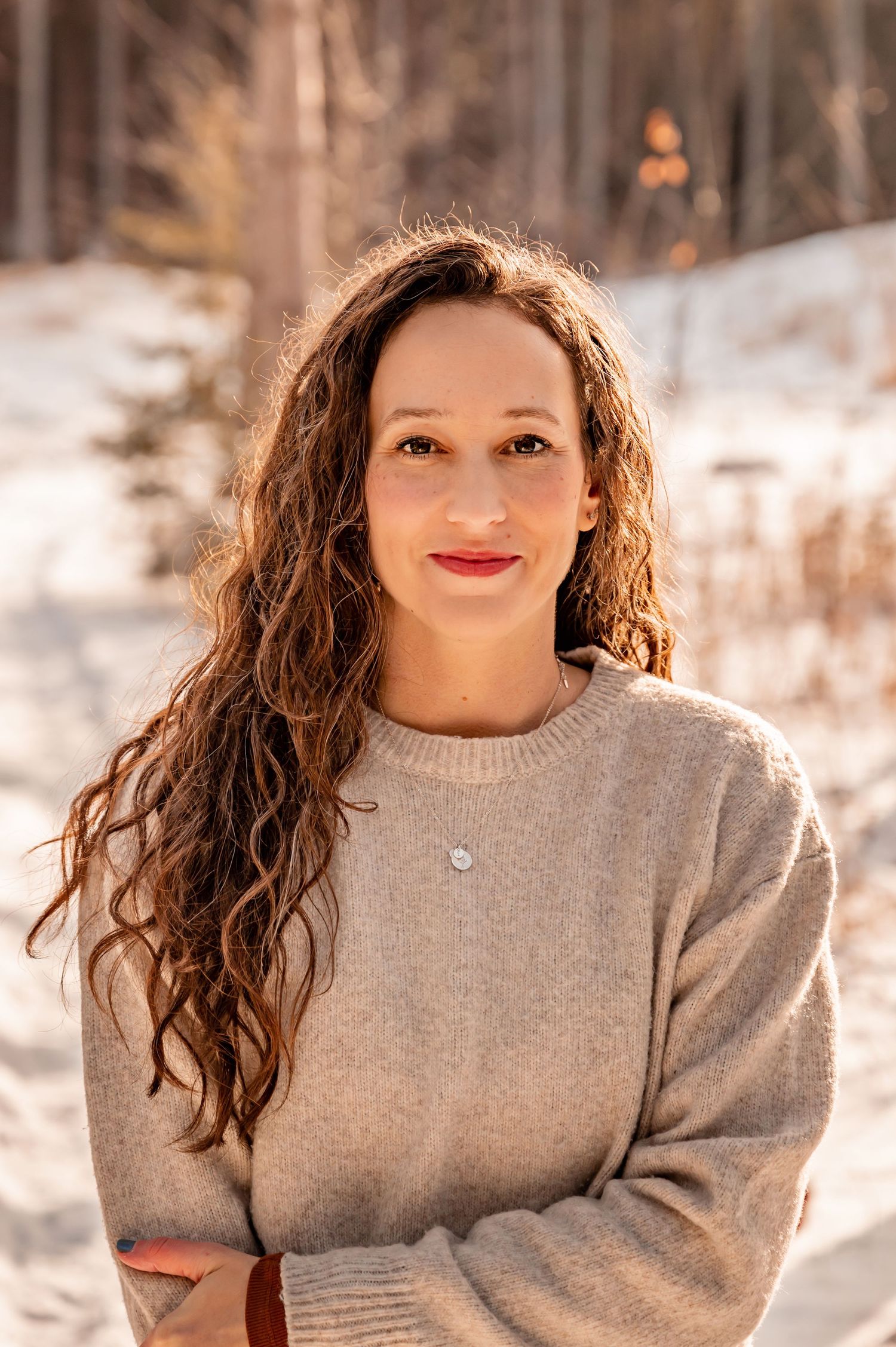 A series of winter portraits showing someone wearing a cozy beige sweater against a snowy outdoor background.