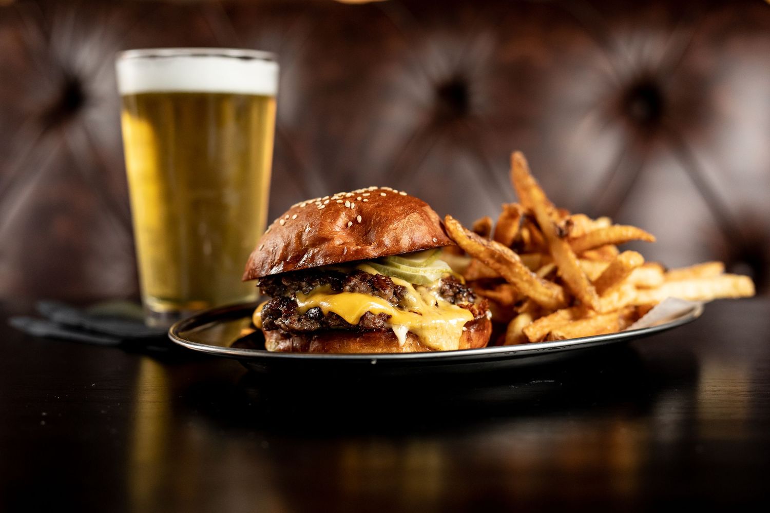 Burger fries and a beer photographed by food and beverage photographer Jonathan Cooper.