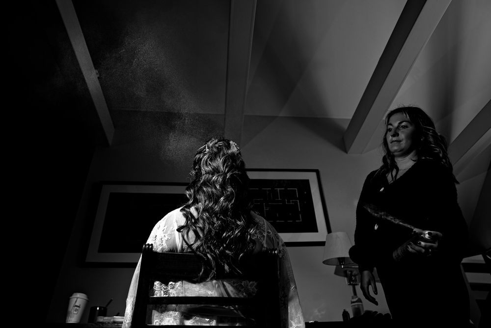 A series of black and white film stills showing dramatic lighting and cinematic compositions in a noir style.