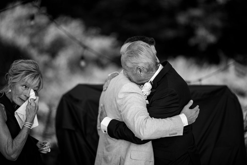 A sequence of black and white photos showing two people dancing together in formal attire at an event.