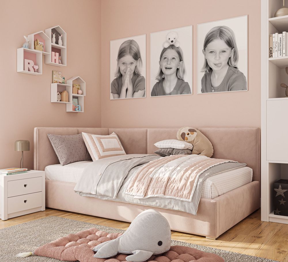 Pink bedroom with portrait gallery wall, daybed, white furniture, and plush decor.