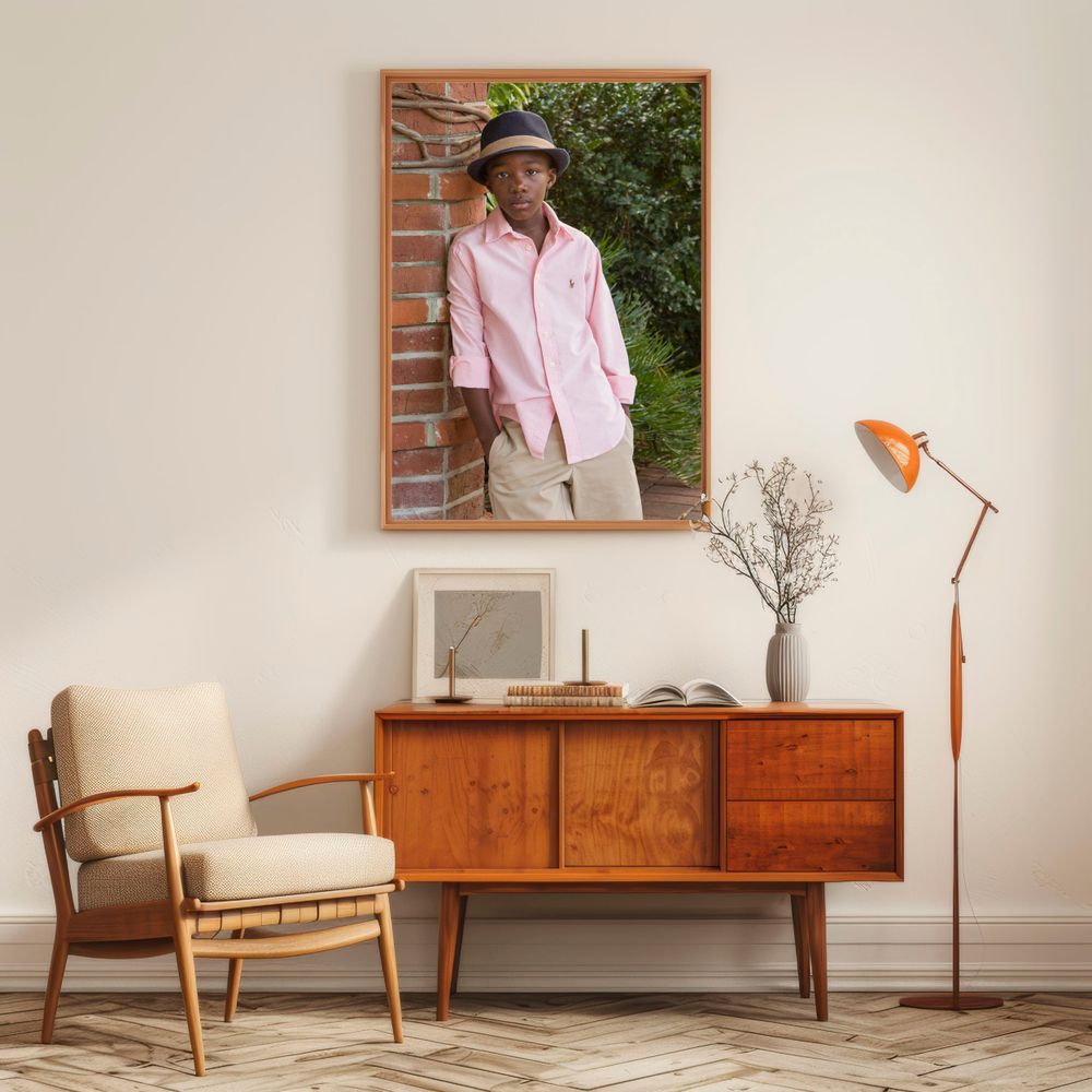 Mid-century modern living room with framed photograph, vintage credenza, and retro chair.