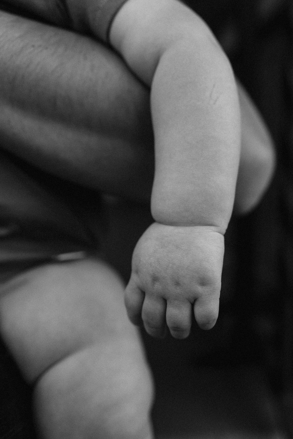 A series of black and white close-up photographs showing a baby's tiny feet and toes in different angles.