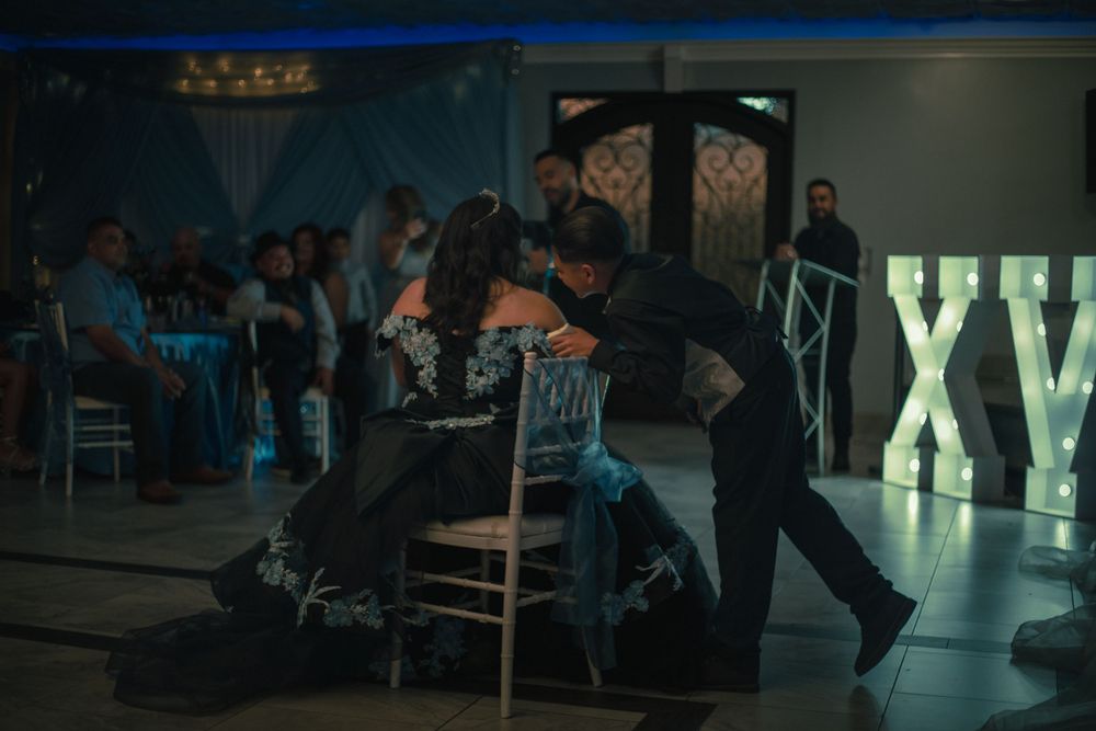Brother of the quinceanera giving a heartfelt speech