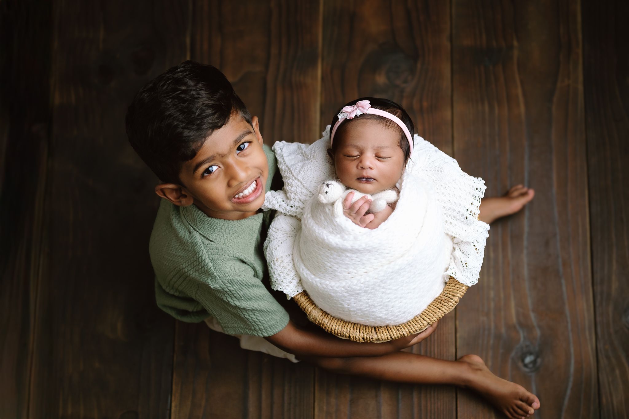 Tiny newborn girl posed in a basket with sweet sibling, soulful maternity and newborn photography, Richards Bay
