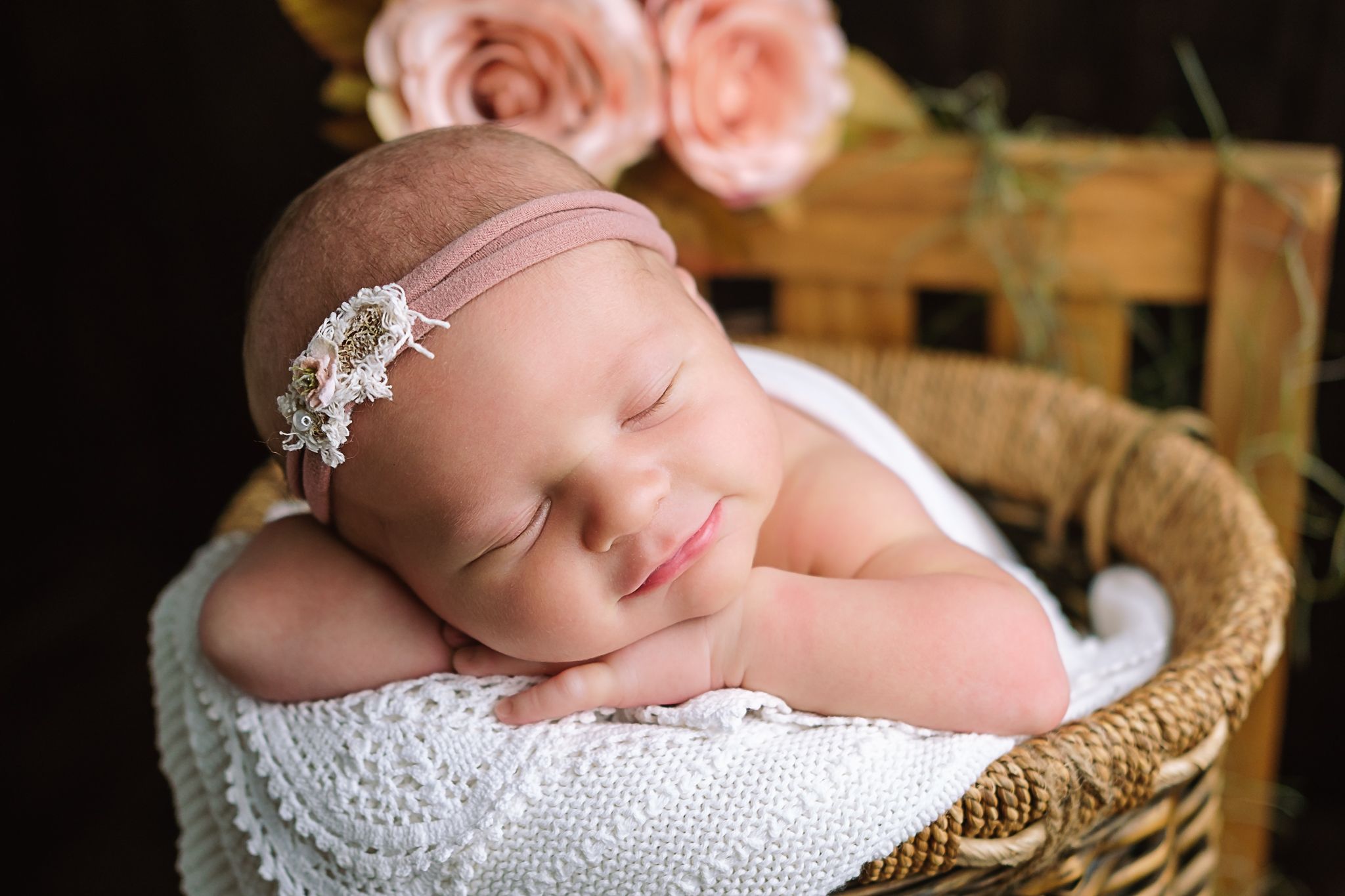 Tiny newborn girl posed in basket on soft textures, calm and soulful newborn photography, Richards Bay