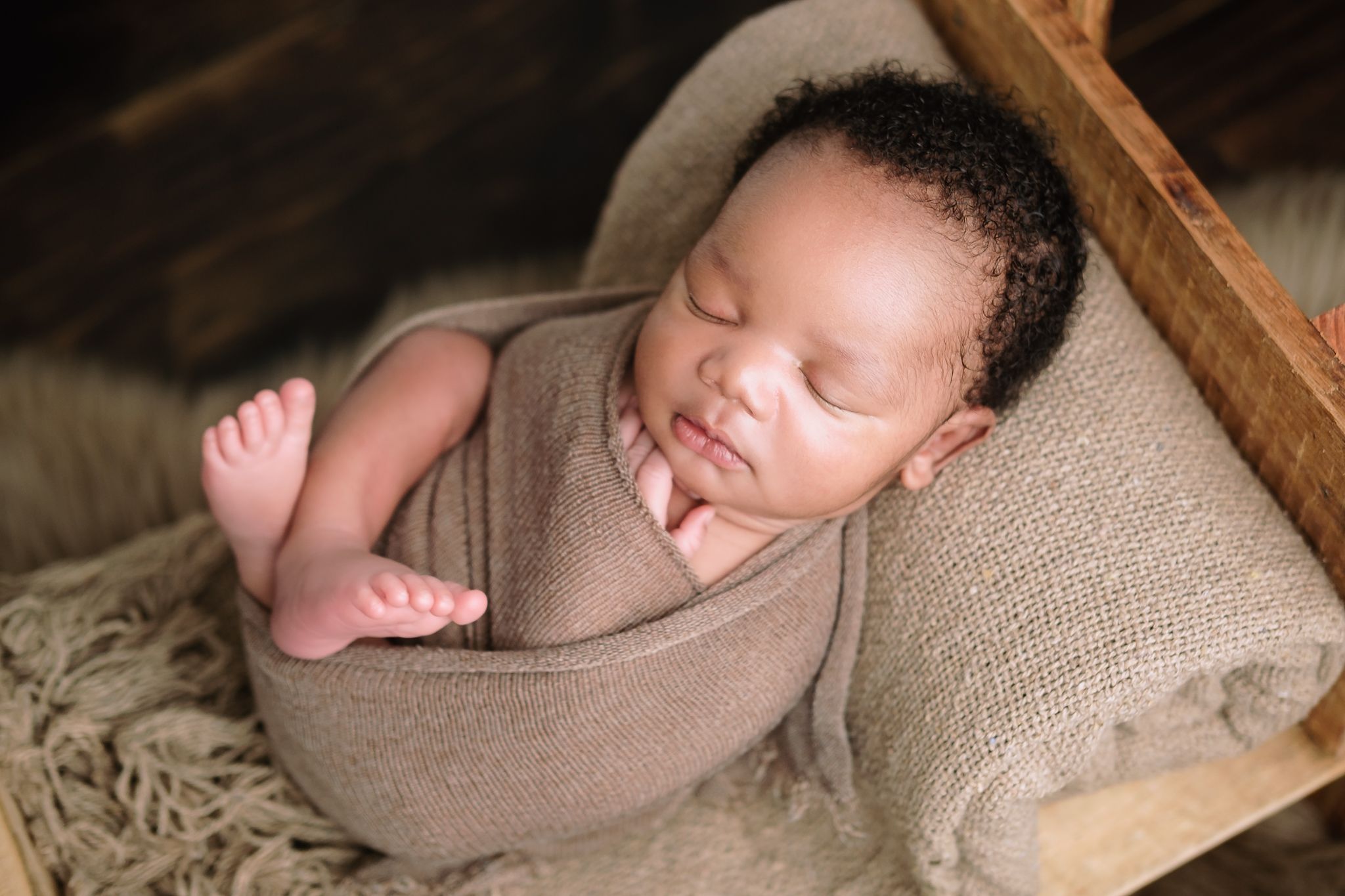 Studio session newborn boy sleeping on a tiny bed, peaceful and calm photography, Richards Bay