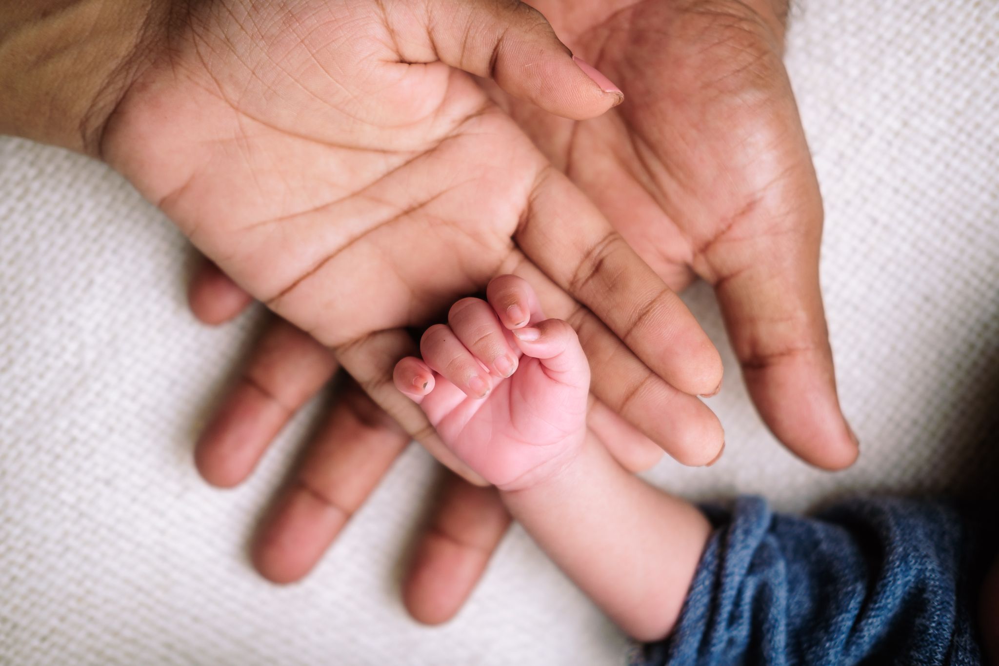 Close-up of newborn baby and parent's hands, studio newborn photography, Empangeni Richards Bay