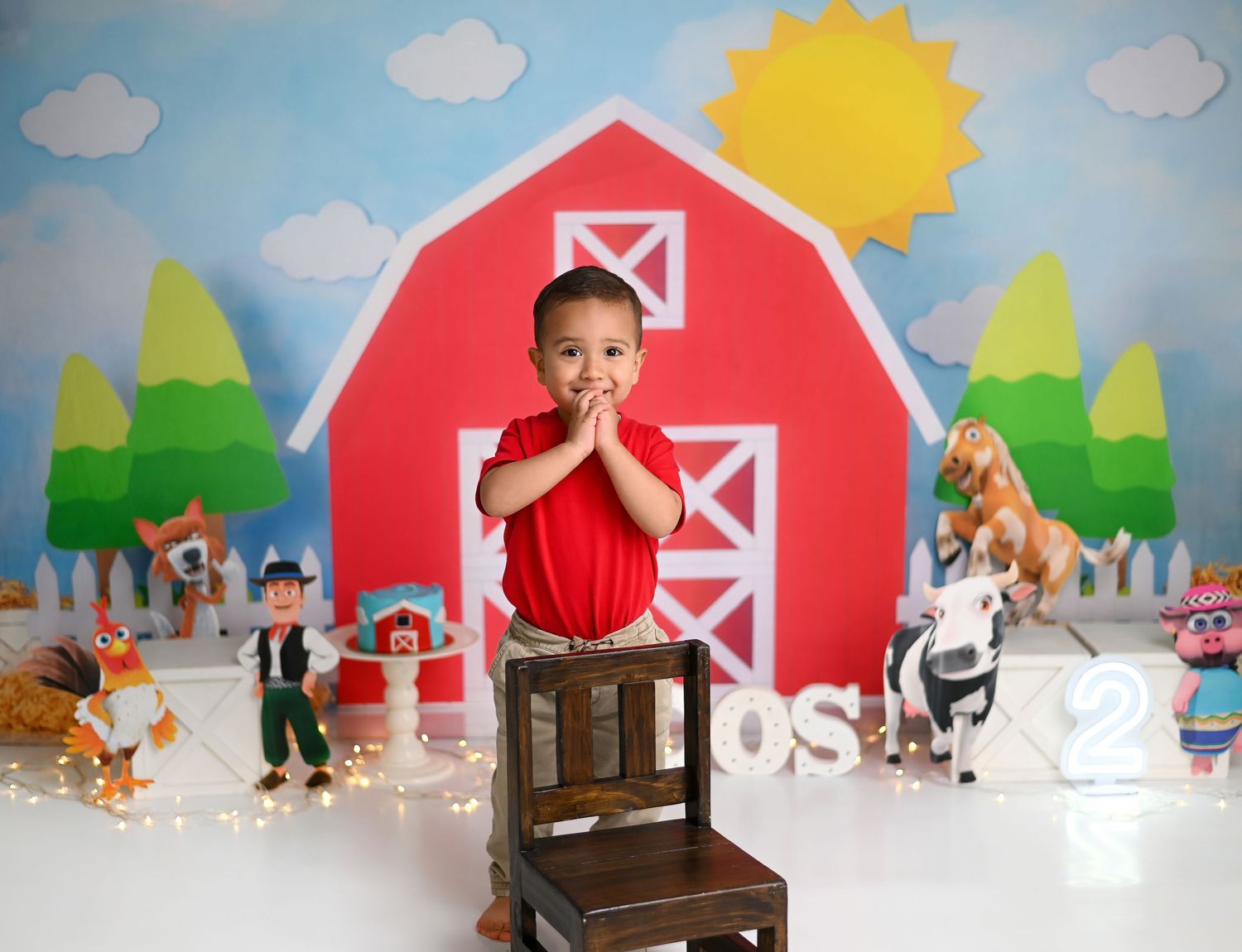 A colorful farm-themed stop motion animation set with a red barn, trees, and clouds against a blue background.