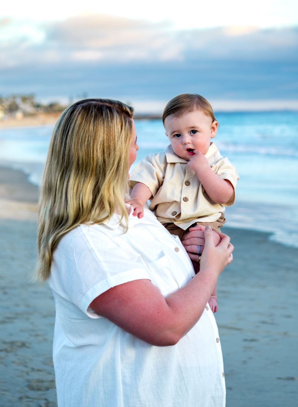 Series of beach photos showing tender moments at sunset by the ocean.