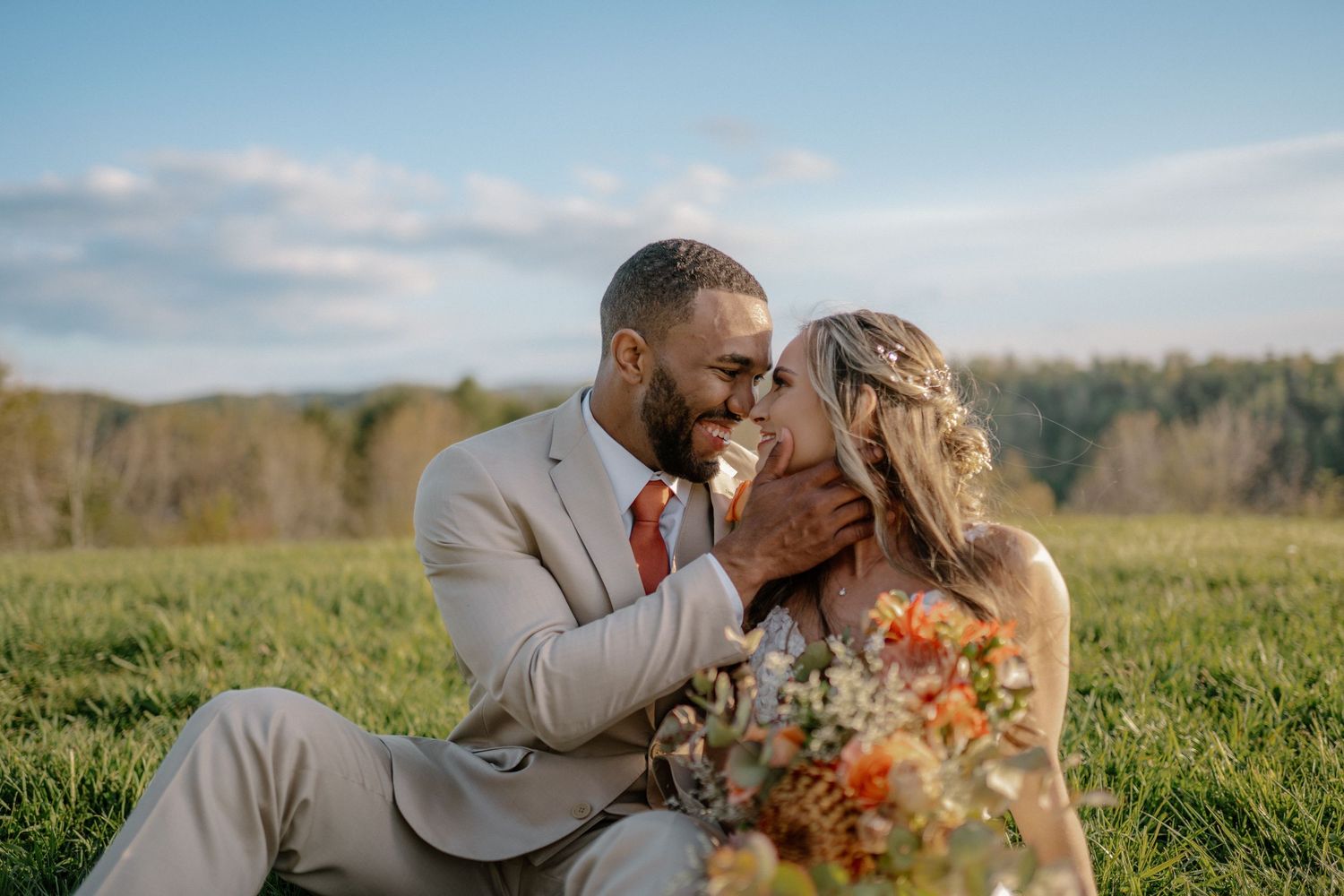 wedding couple pose smiling at each other under magnolia tree