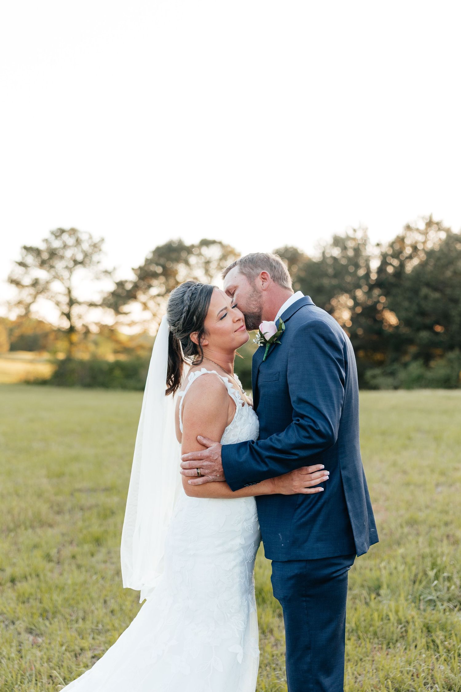 Newlyweds share an intimate toast at a dimly lit bar during their reception.